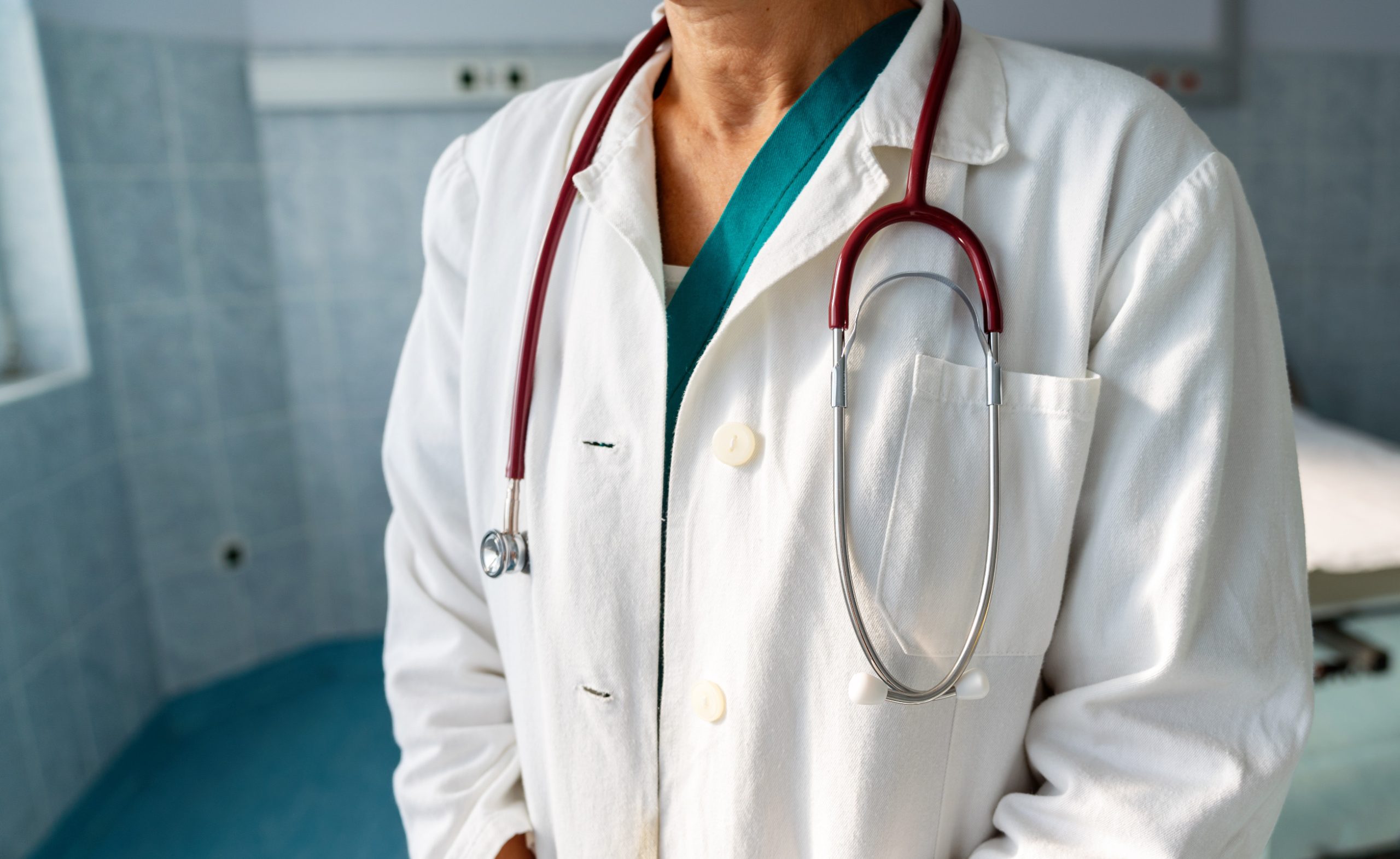 Portrait of doctor holding stethoscope in hospital